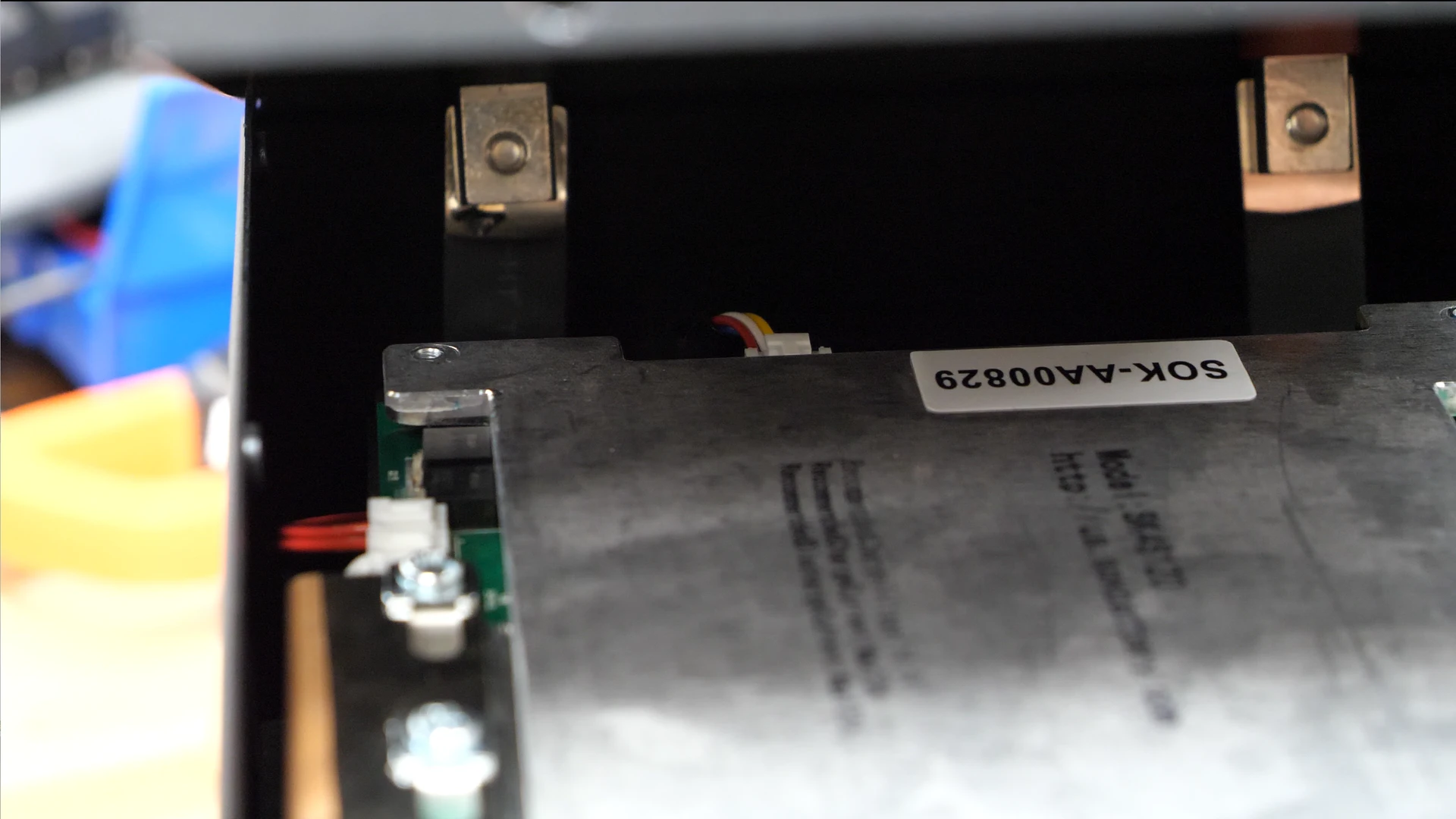 An inside view of the Lithium battery showing what the terminals and the BMS inside look like
